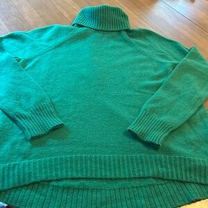 J Crew super soft green turtle neck sweater. Nylon & wool material. Size small.
